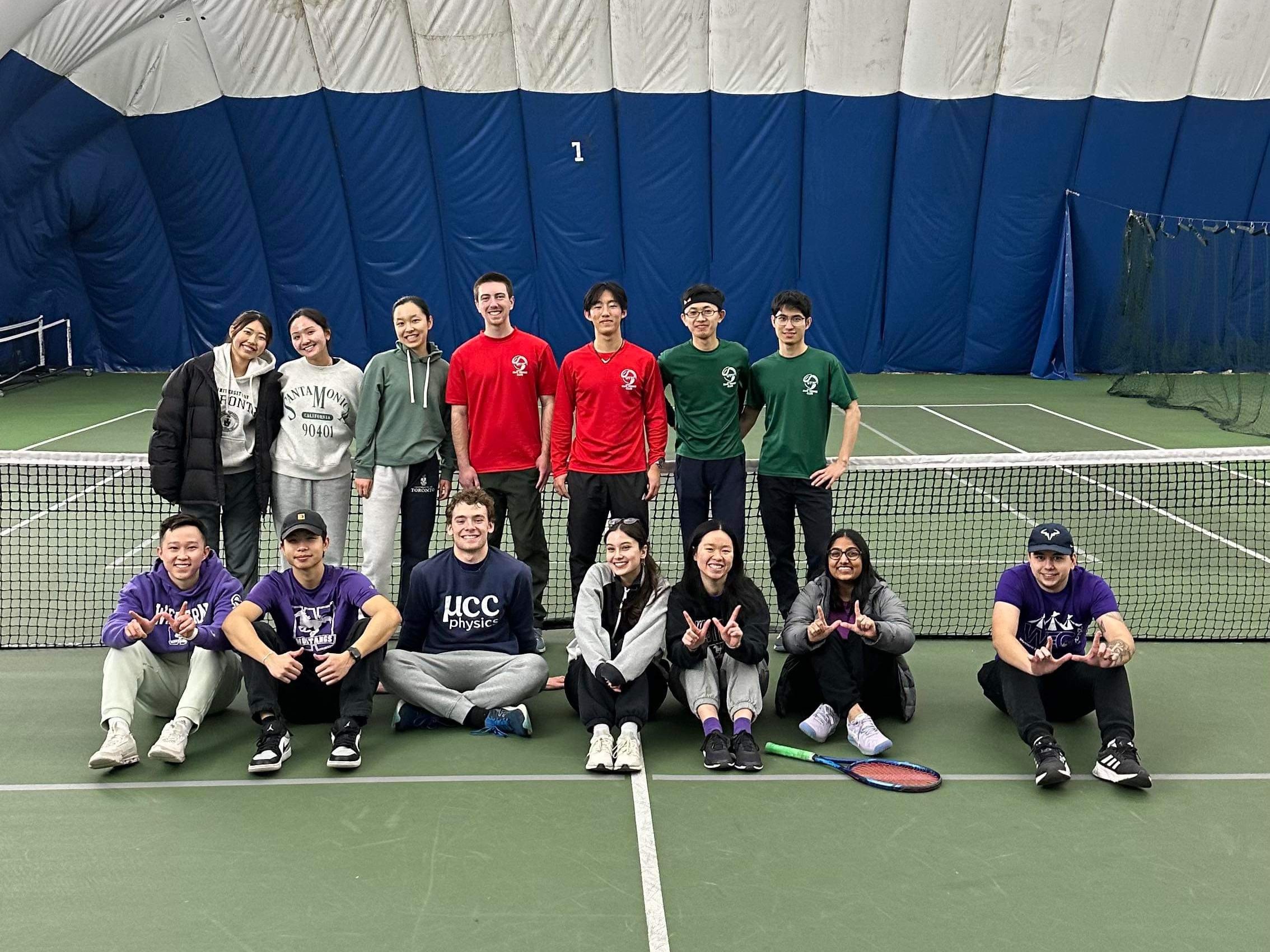 Group photo of 14 Tennis Club members